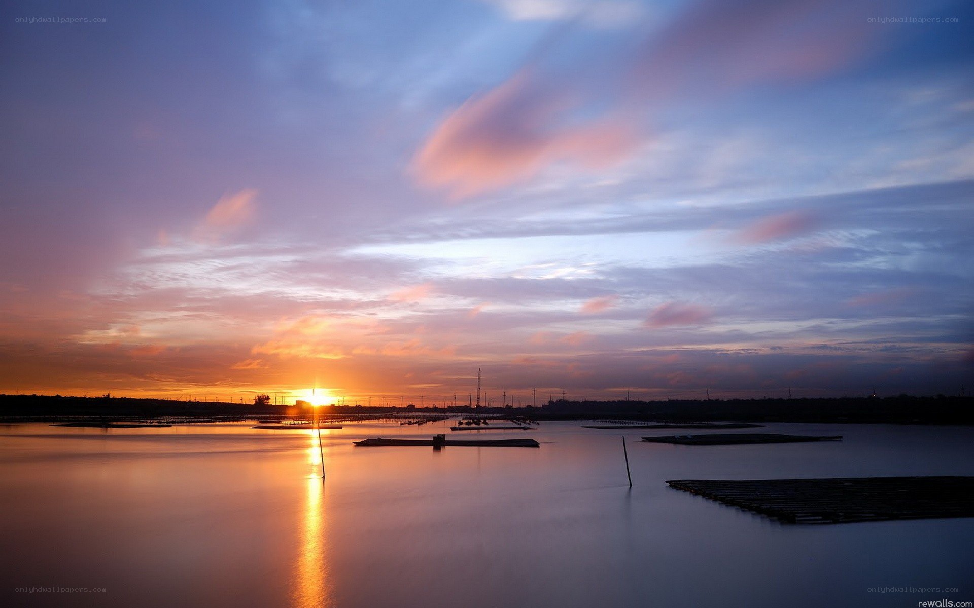 Sunset over a calm water body