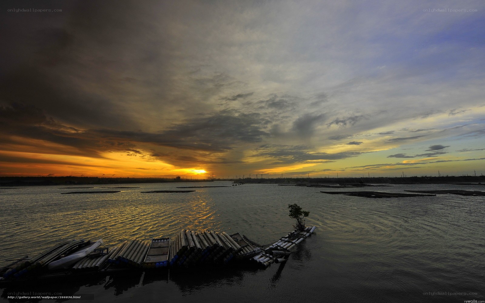 Sunset over a calm water body