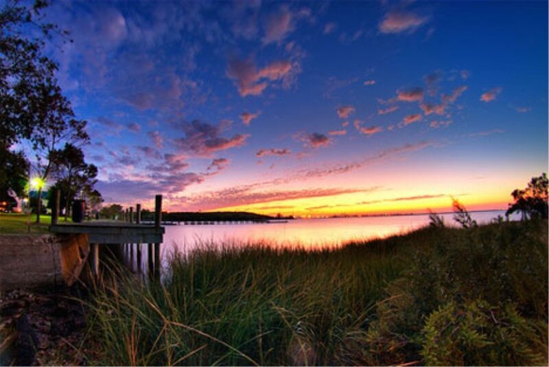 sunset over a calm waterfront