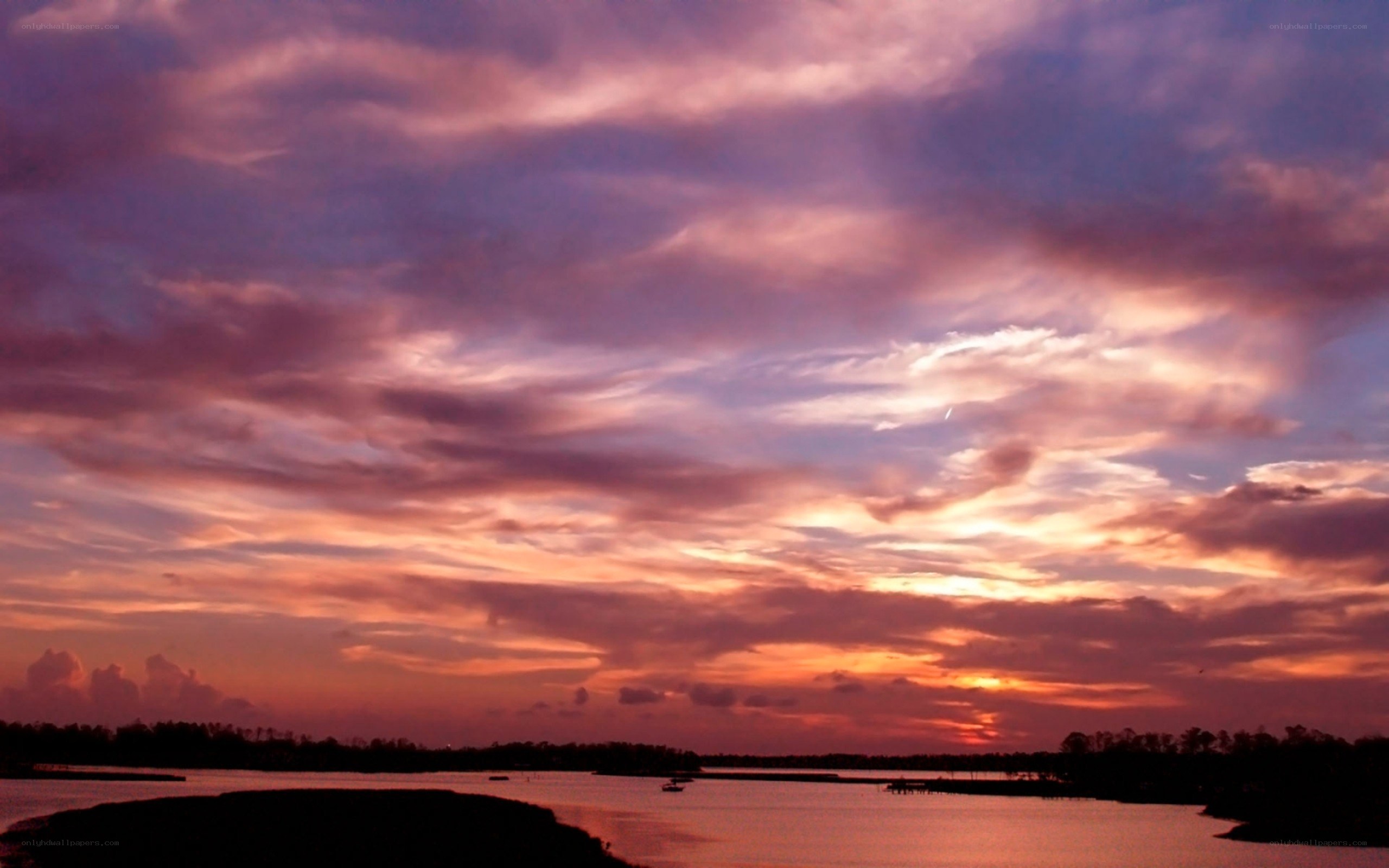 sunset over a calm waterway