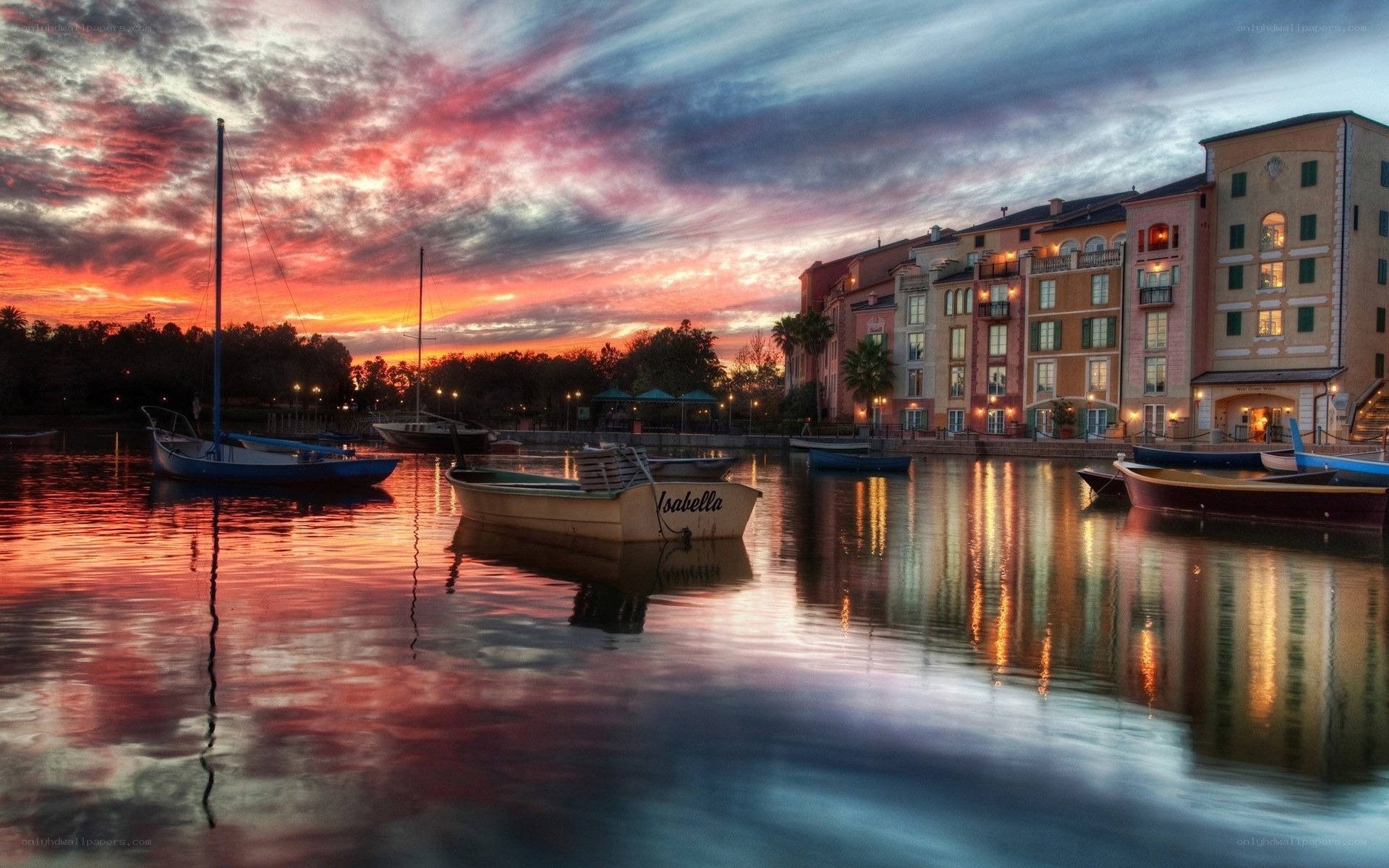 Sunset over a canal with boats