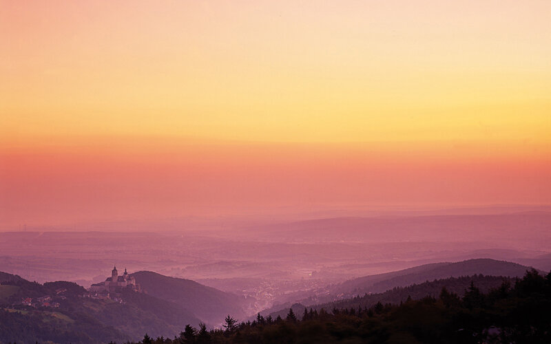 Sunset over a castle on a hill