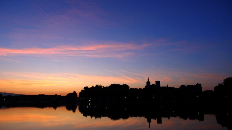 sunset over a castle silhouette