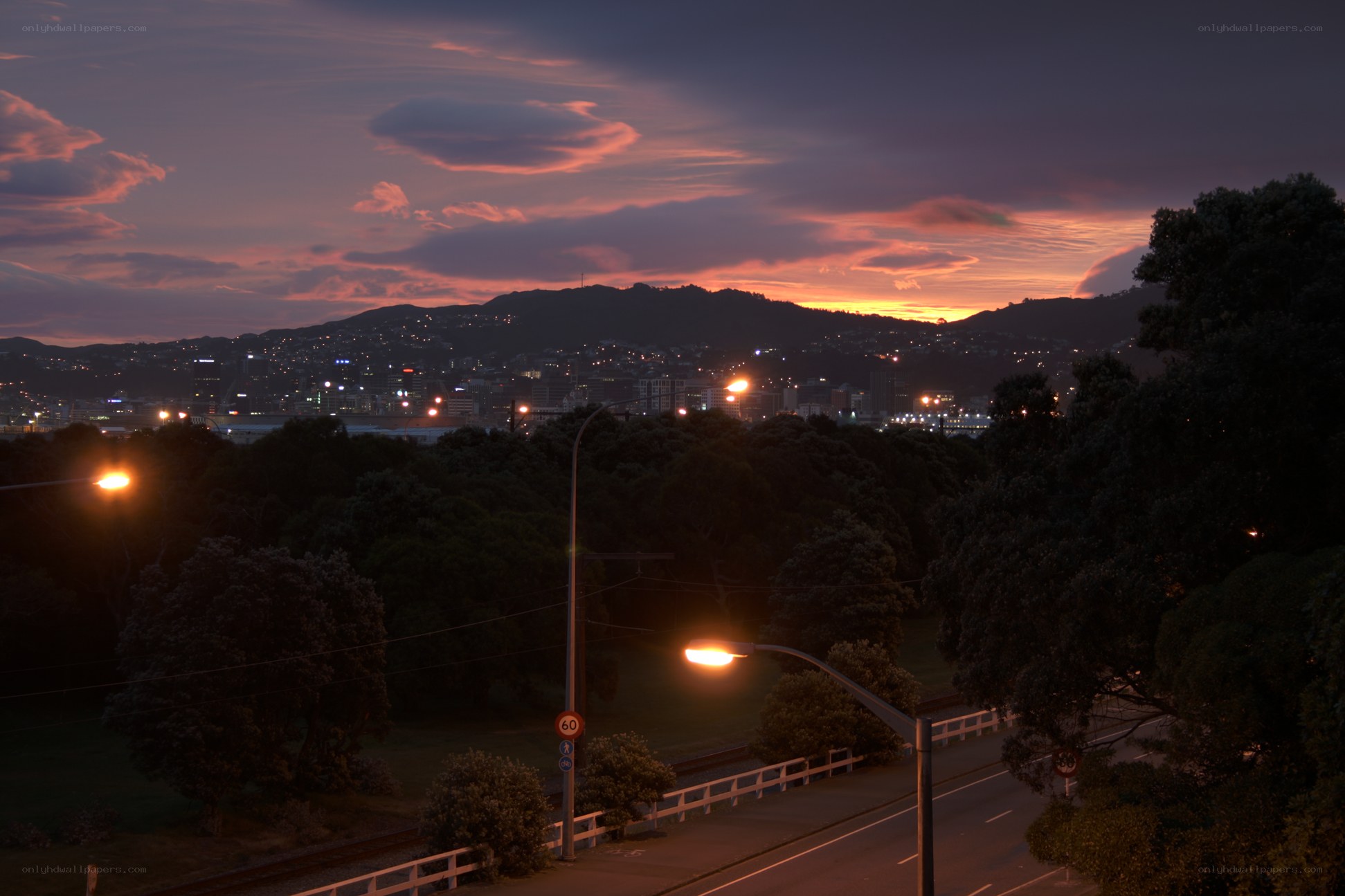 sunset over a city at dusk