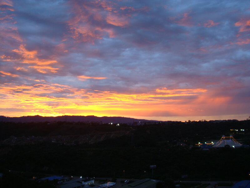 Sunset over a city at dusk