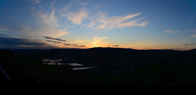 sunset over a city at dusk