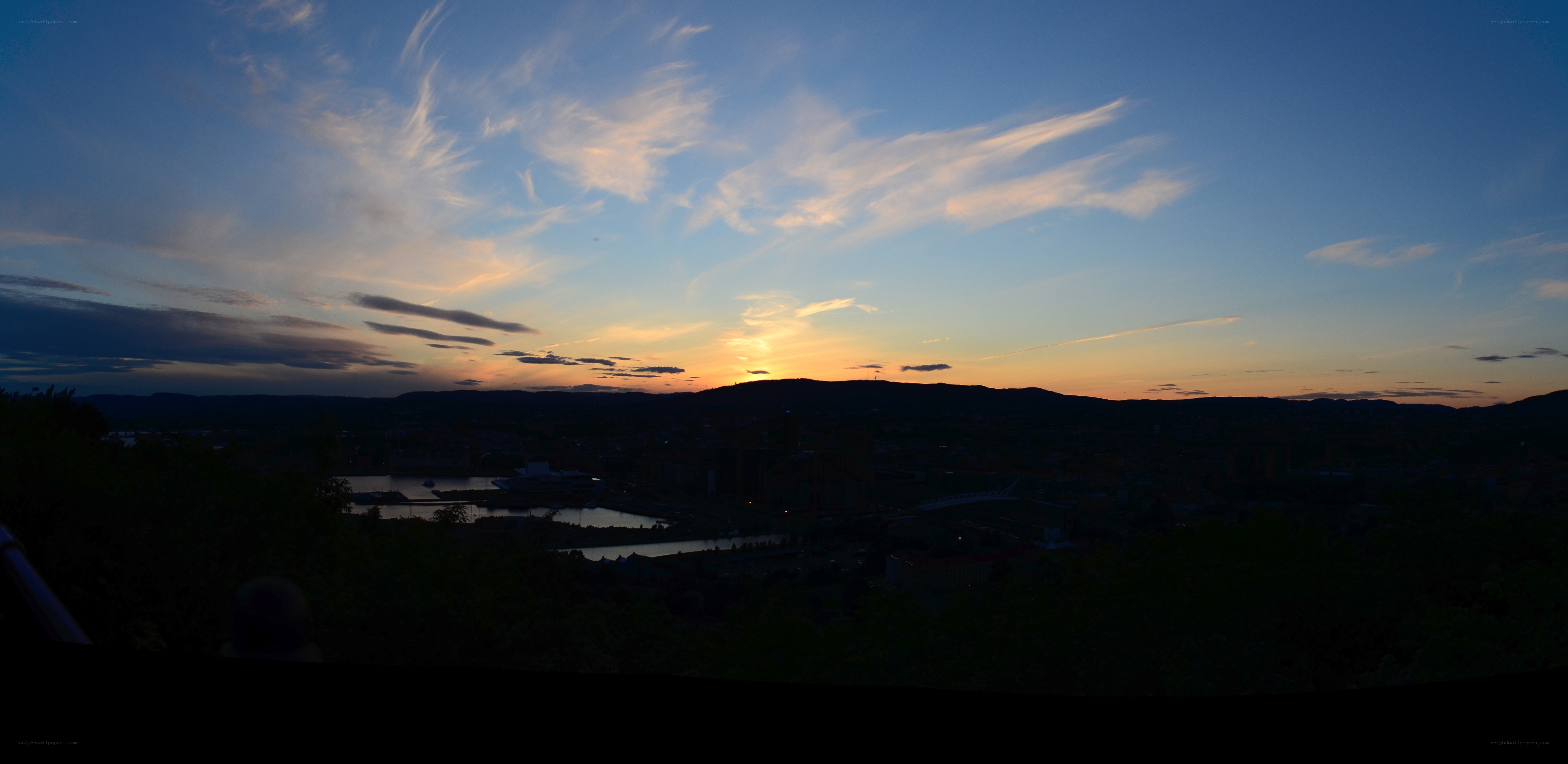 sunset over a city at dusk