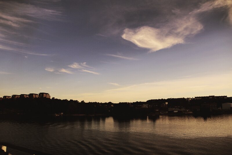 sunset over a city lake