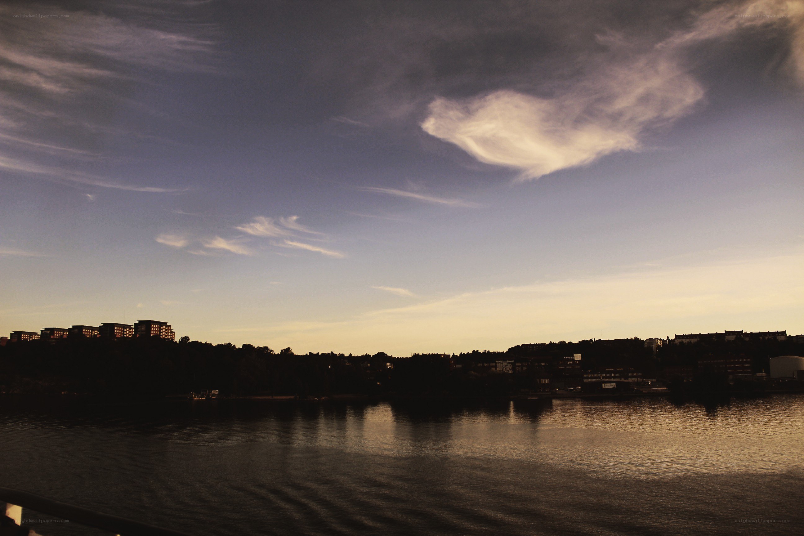 sunset over a city lake
