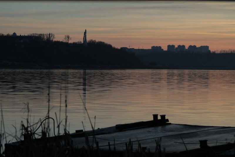 sunset over a city river