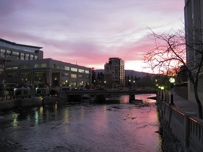 sunset over a city river