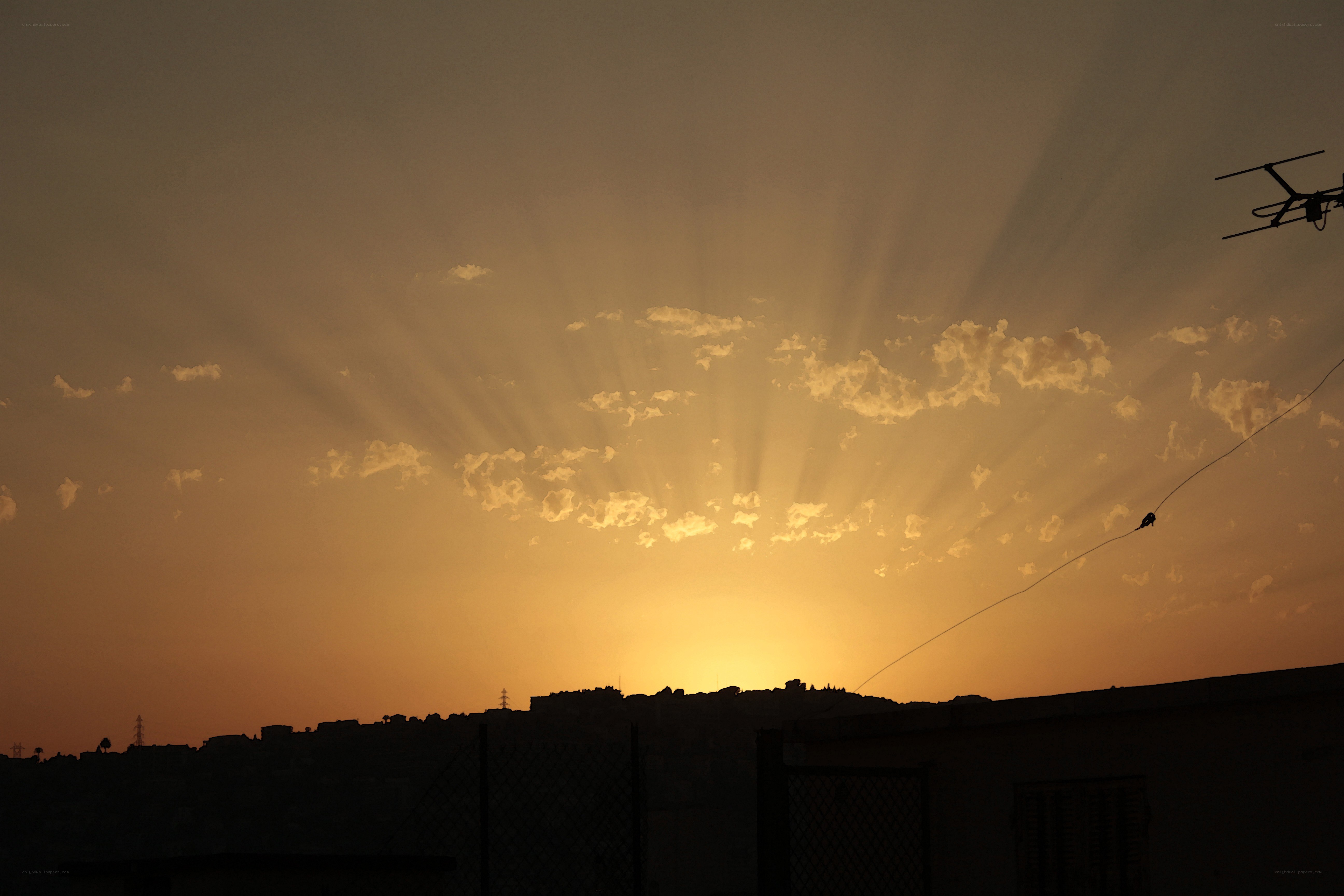 Sunset over a city silhouette