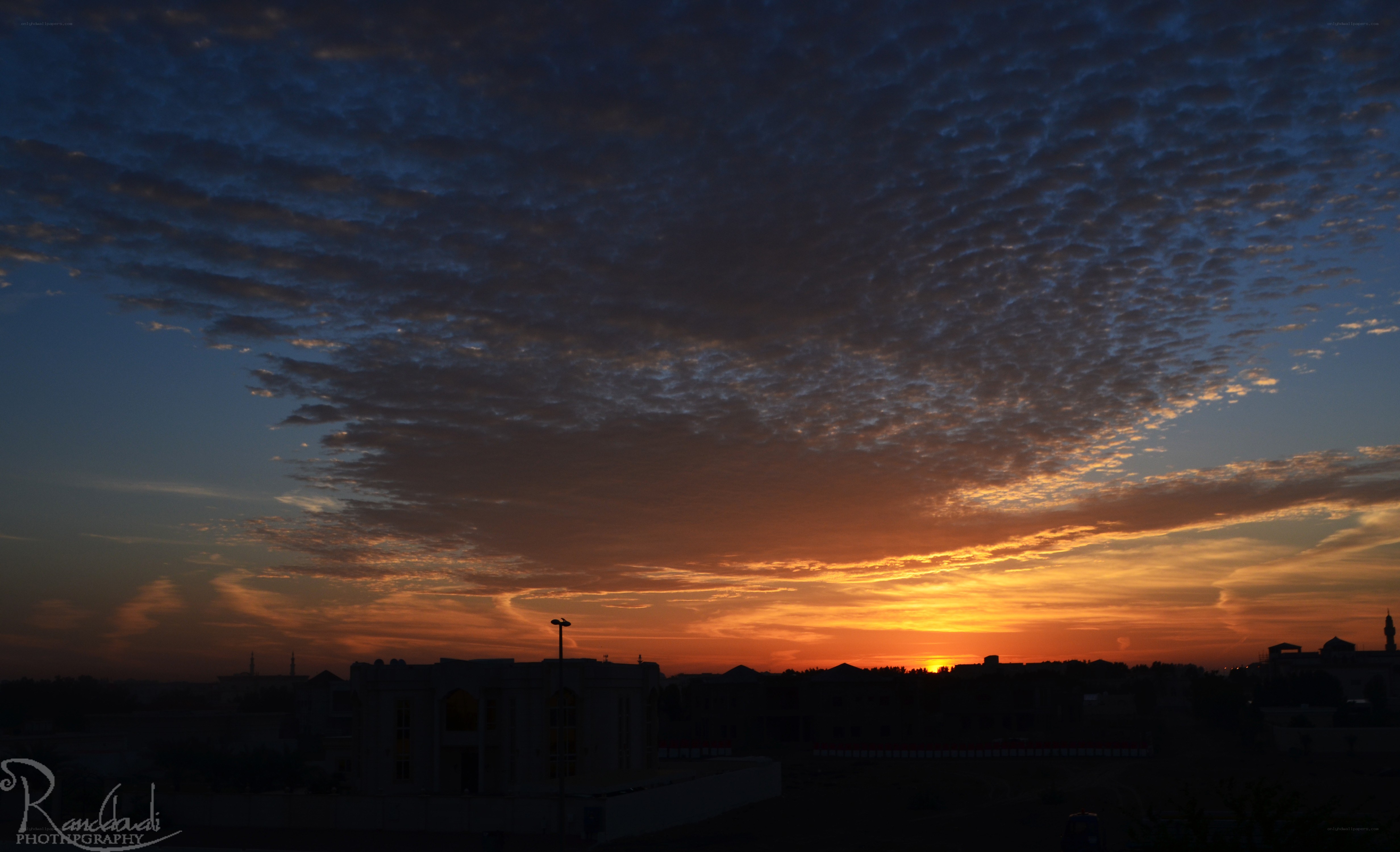 Sunset over a city skyline