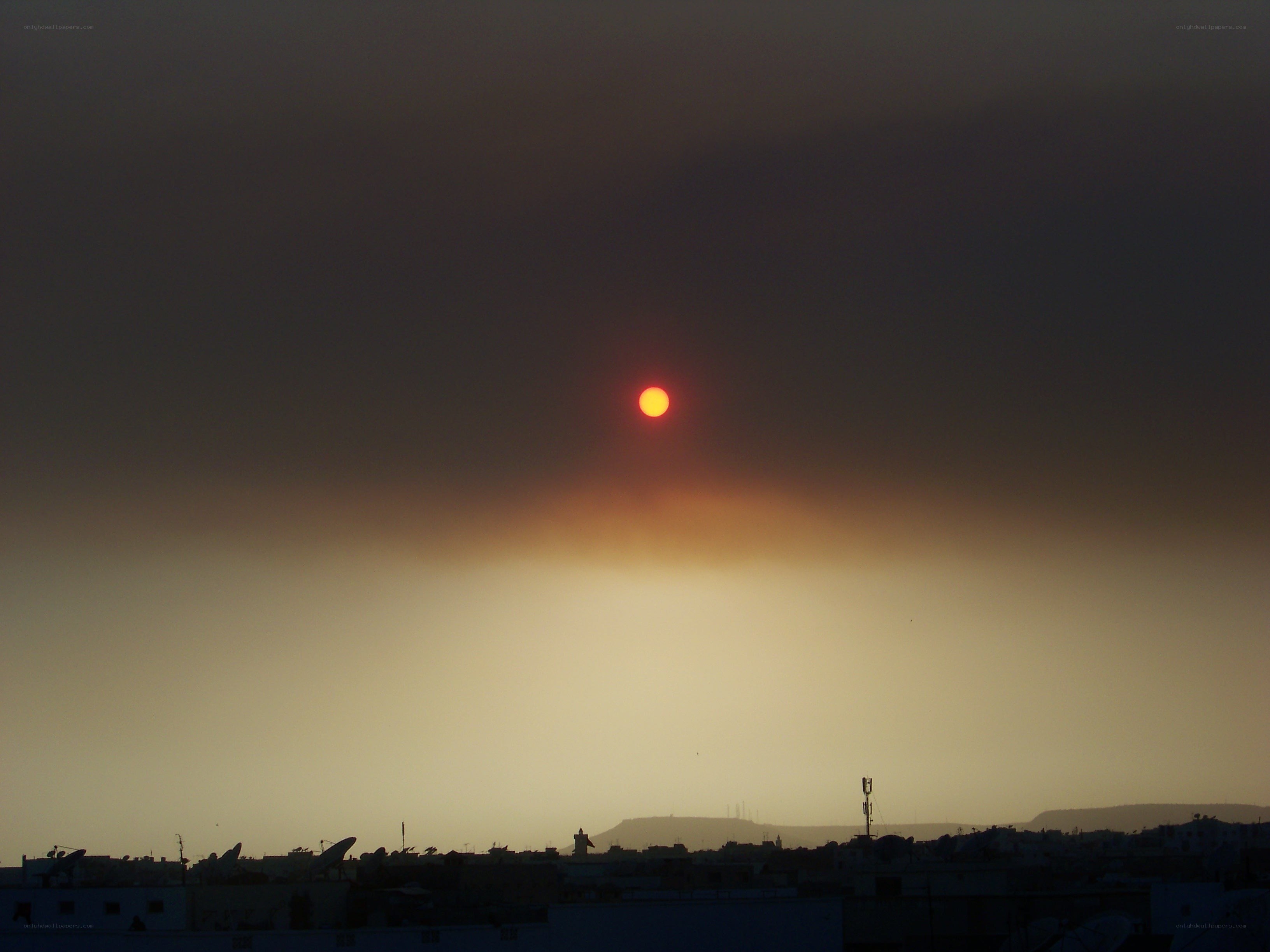 Sunset over a city skyline