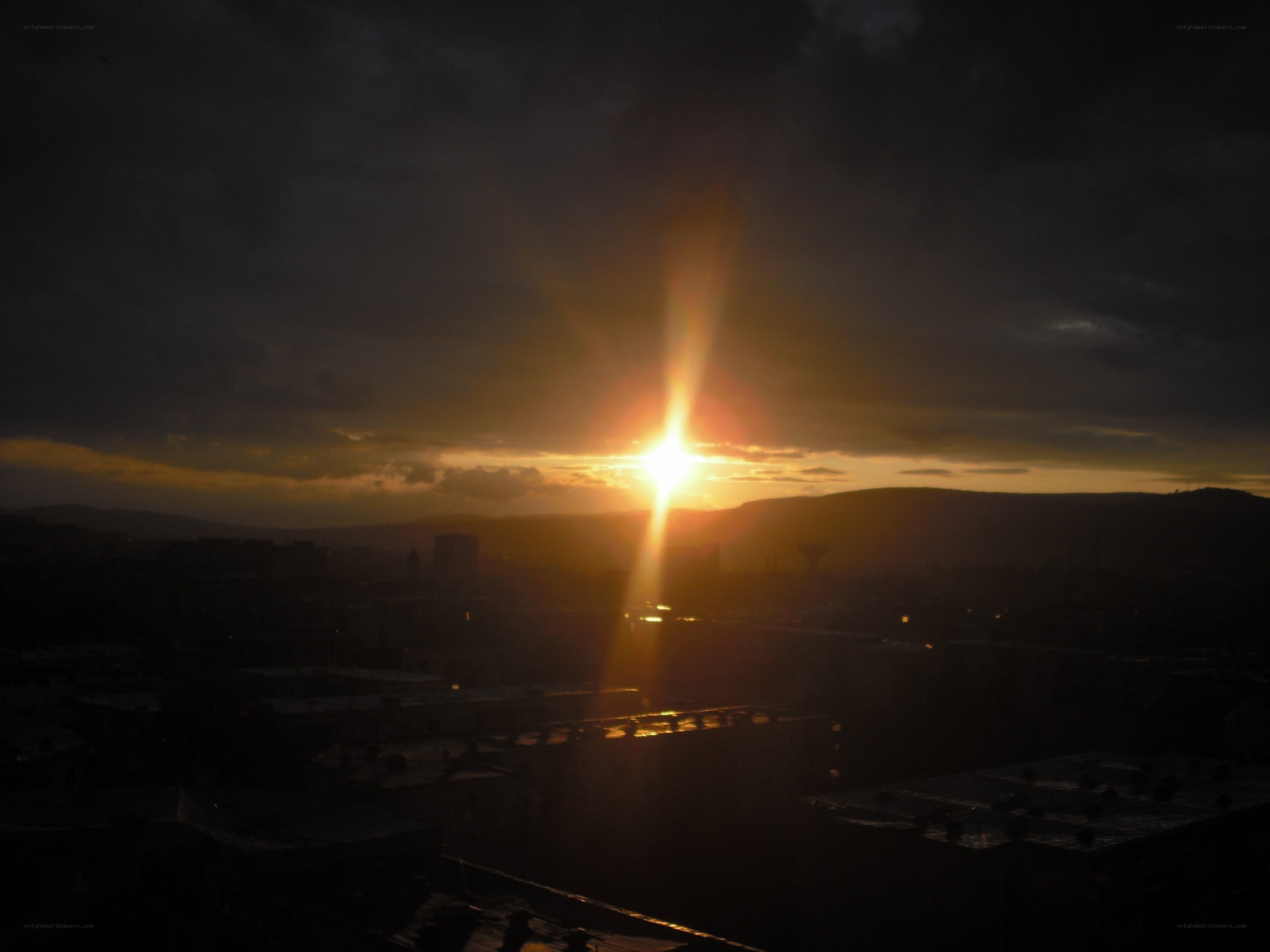 Sunset over a city skyline