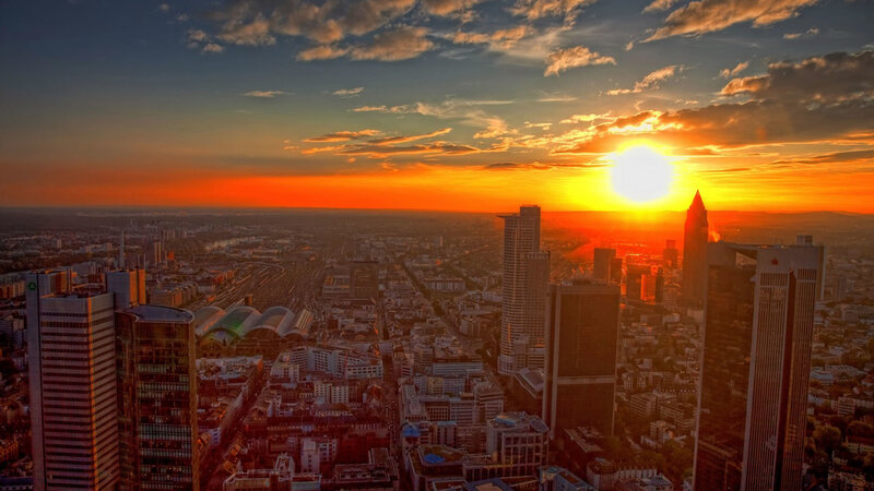 Sunset over a city skyline