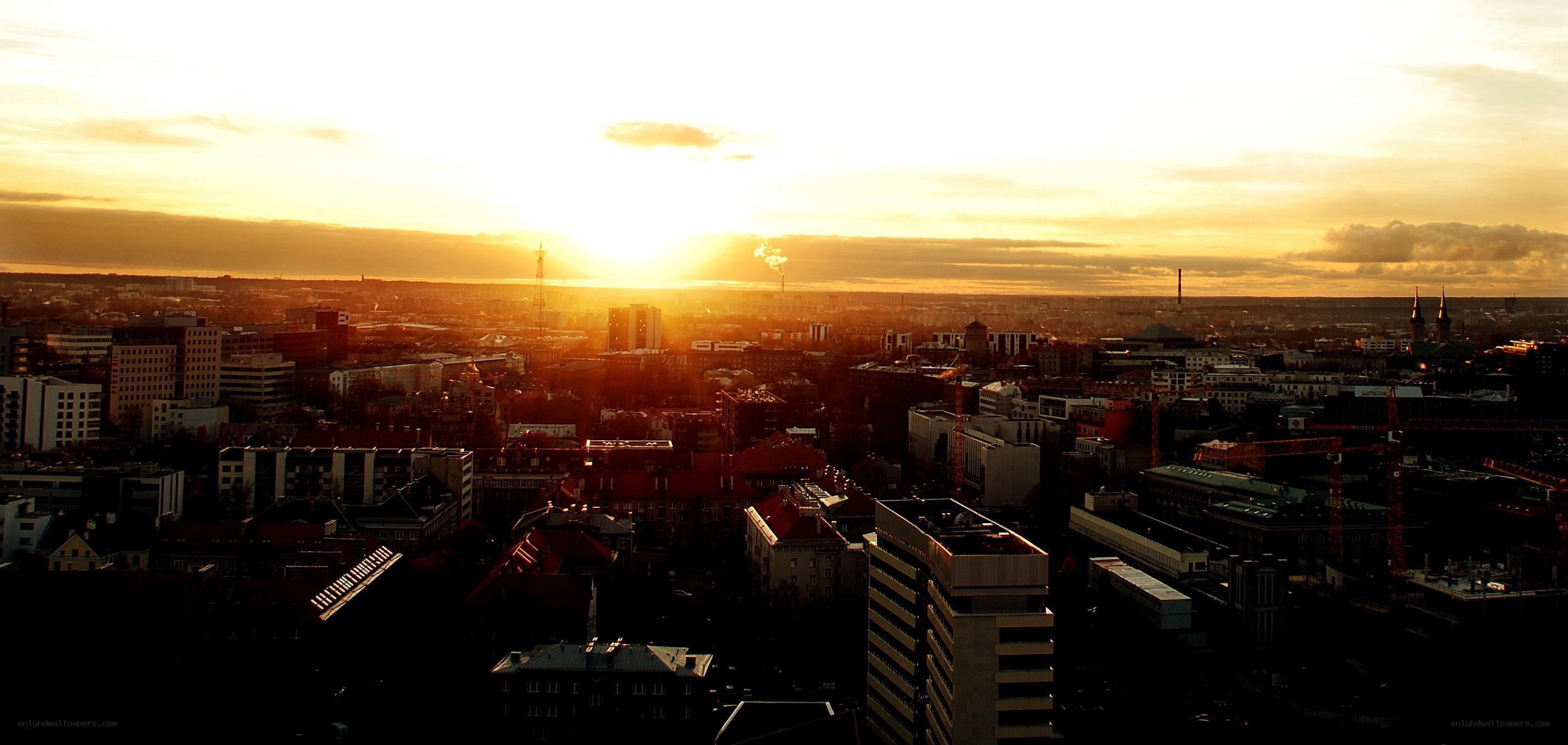 Sunset over a city skyline