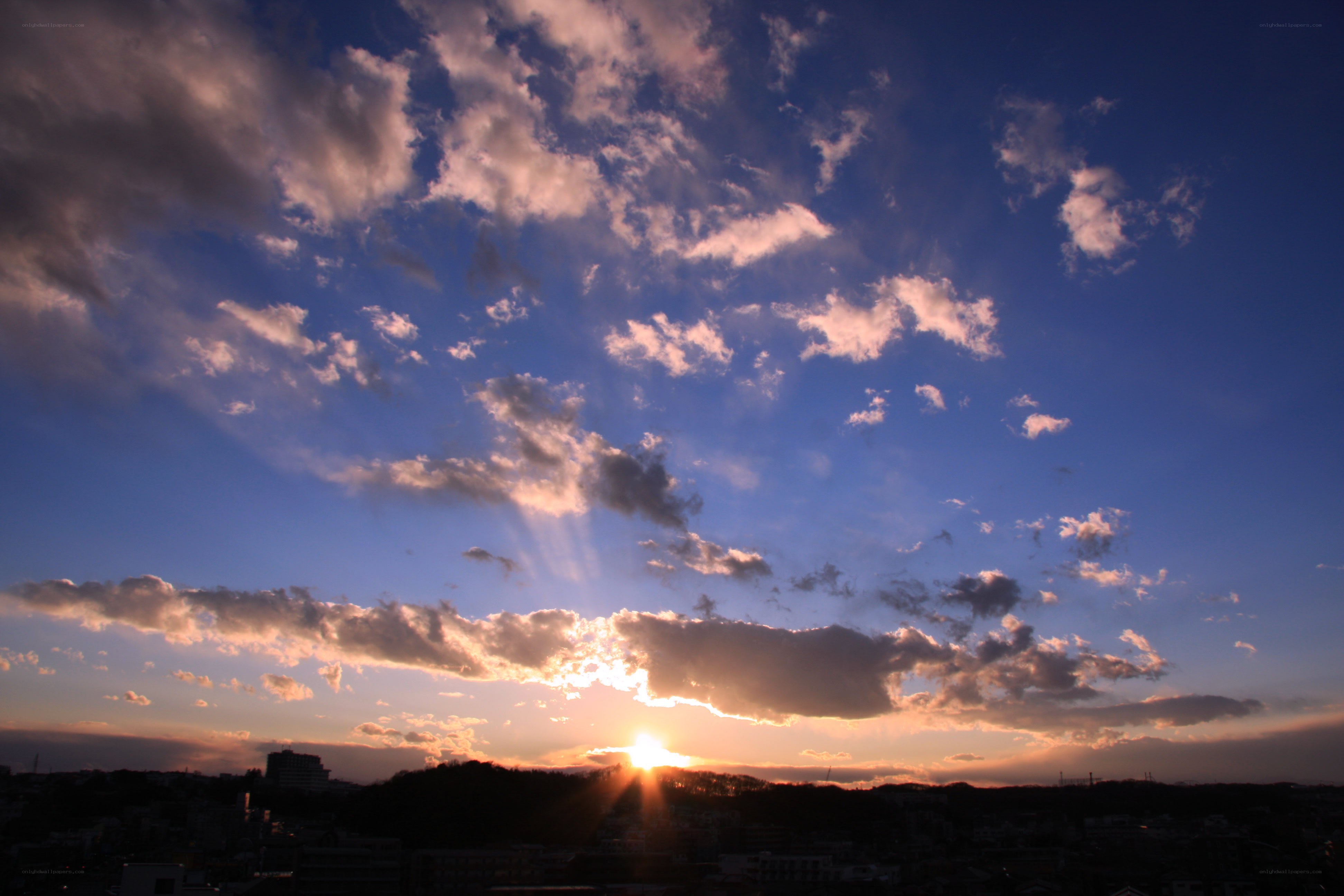 sunset over a city skyline