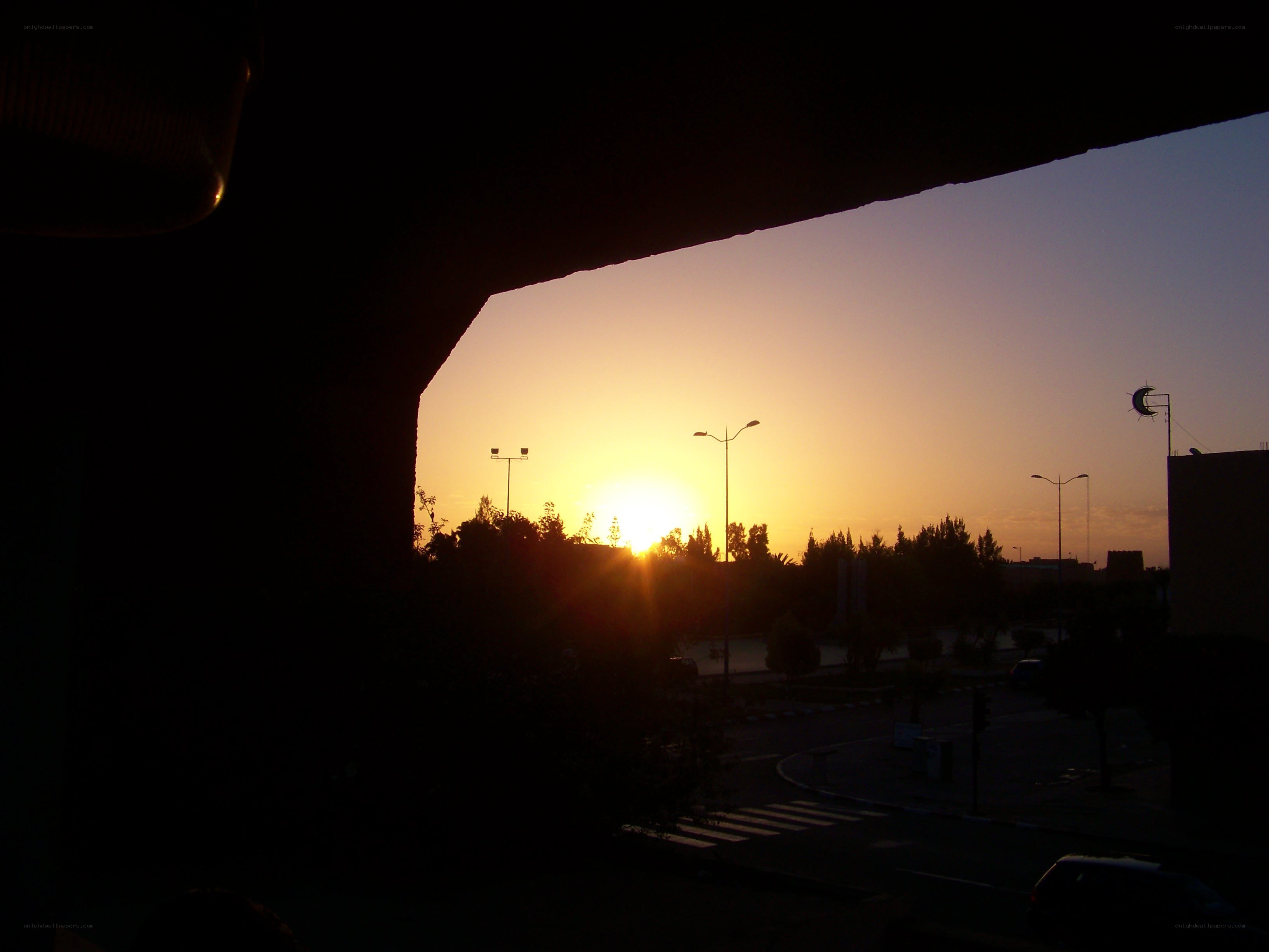 sunset over a city street