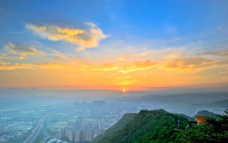 Sunset over a city valley