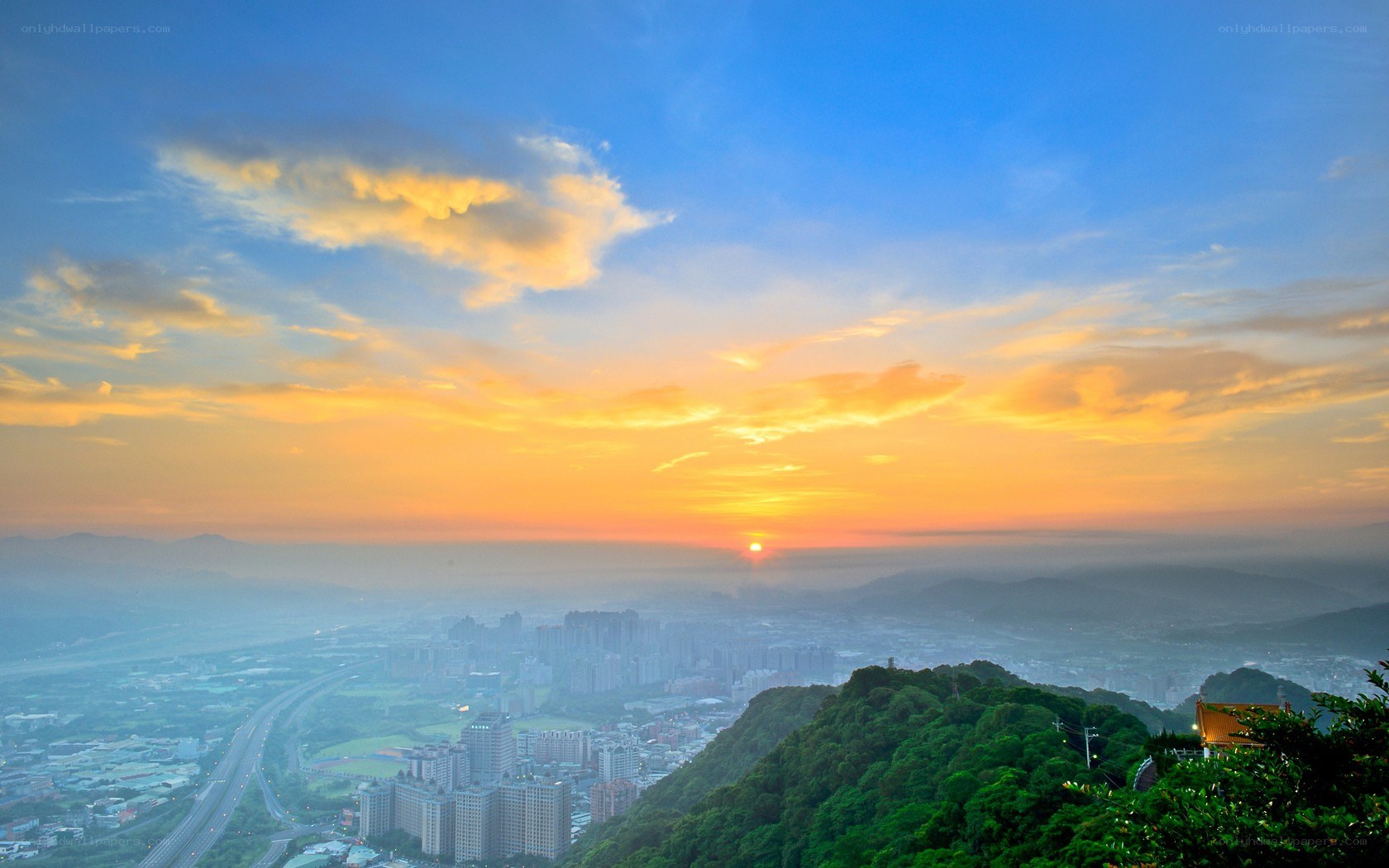 Sunset over a city valley