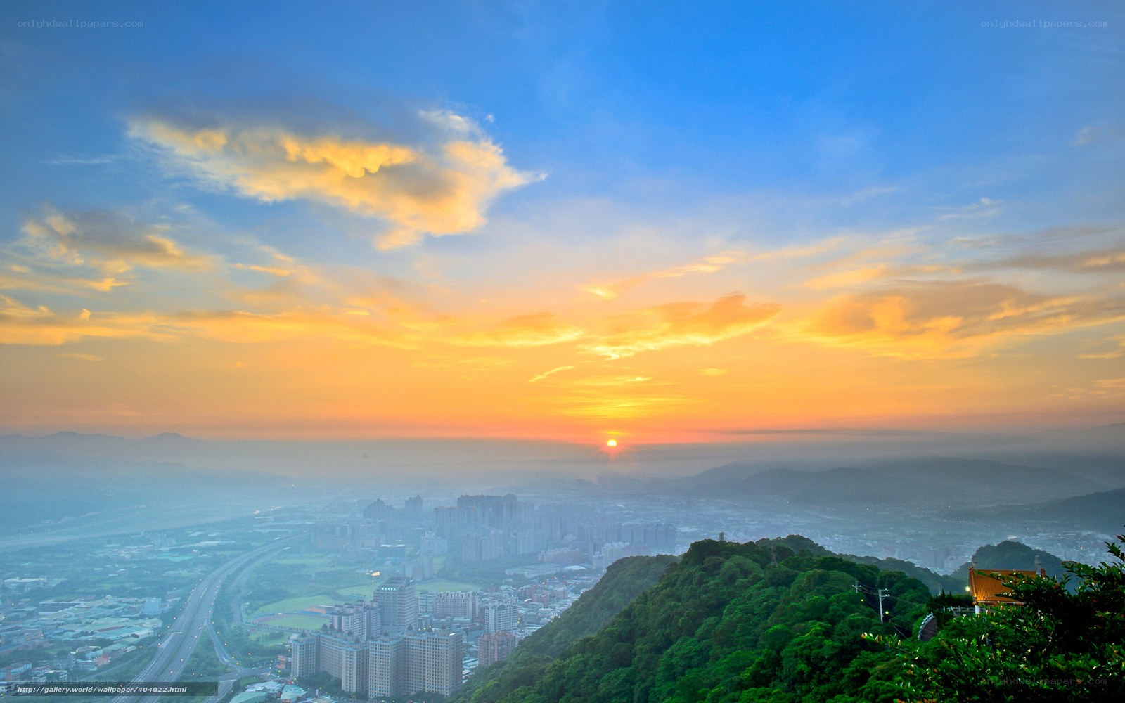 Sunset over a city valley