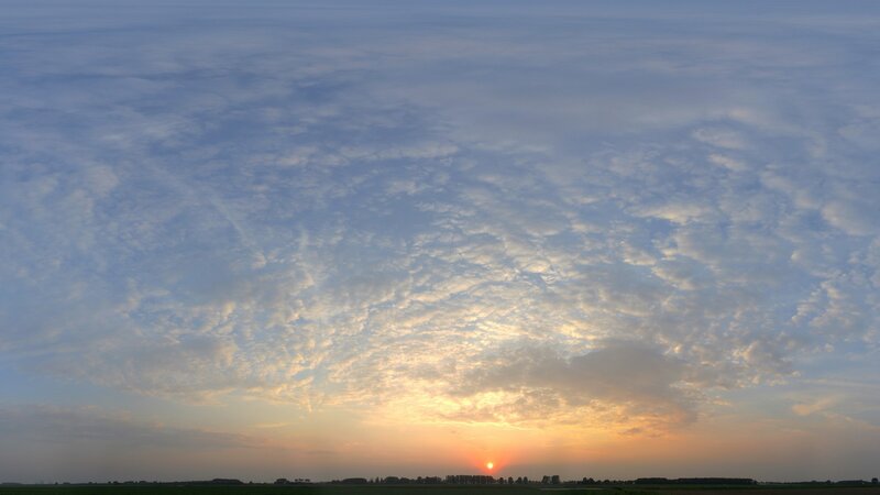 Sunset over a cloudy field