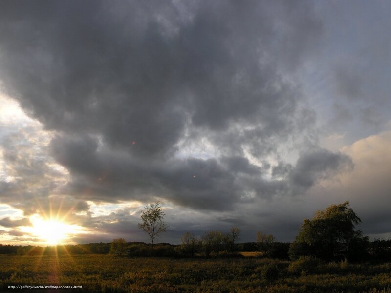 Sunset over a cloudy field