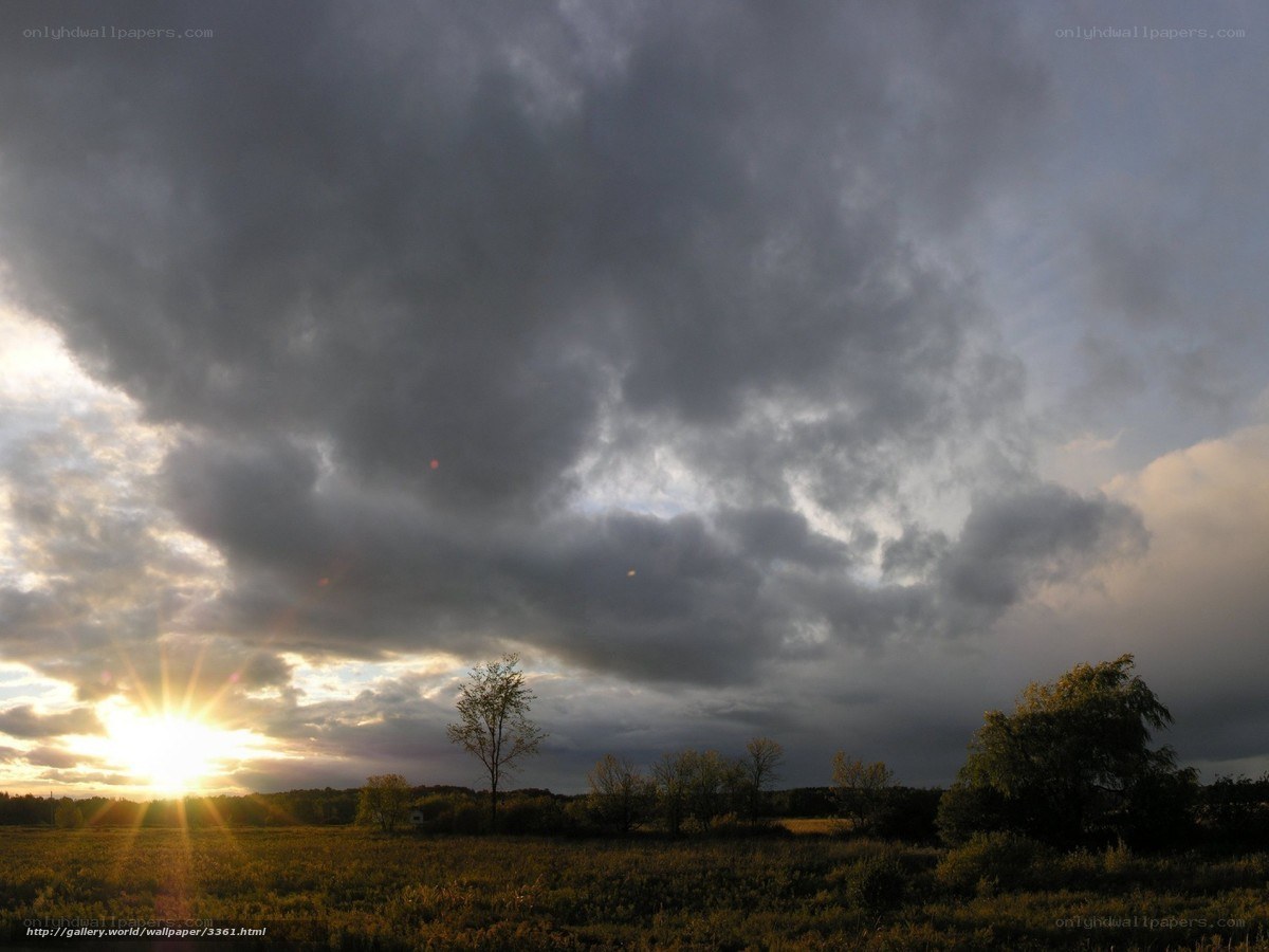 Sunset over a cloudy field