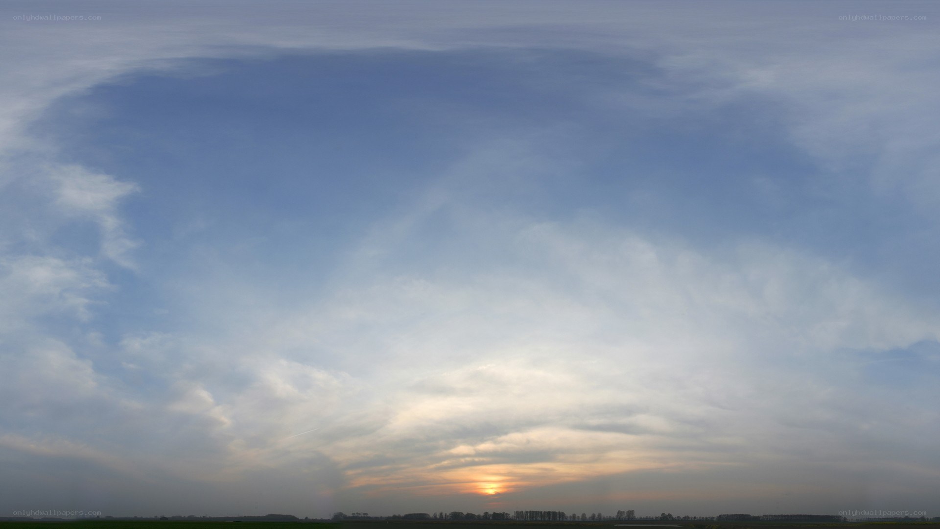sunset over a cloudy sky