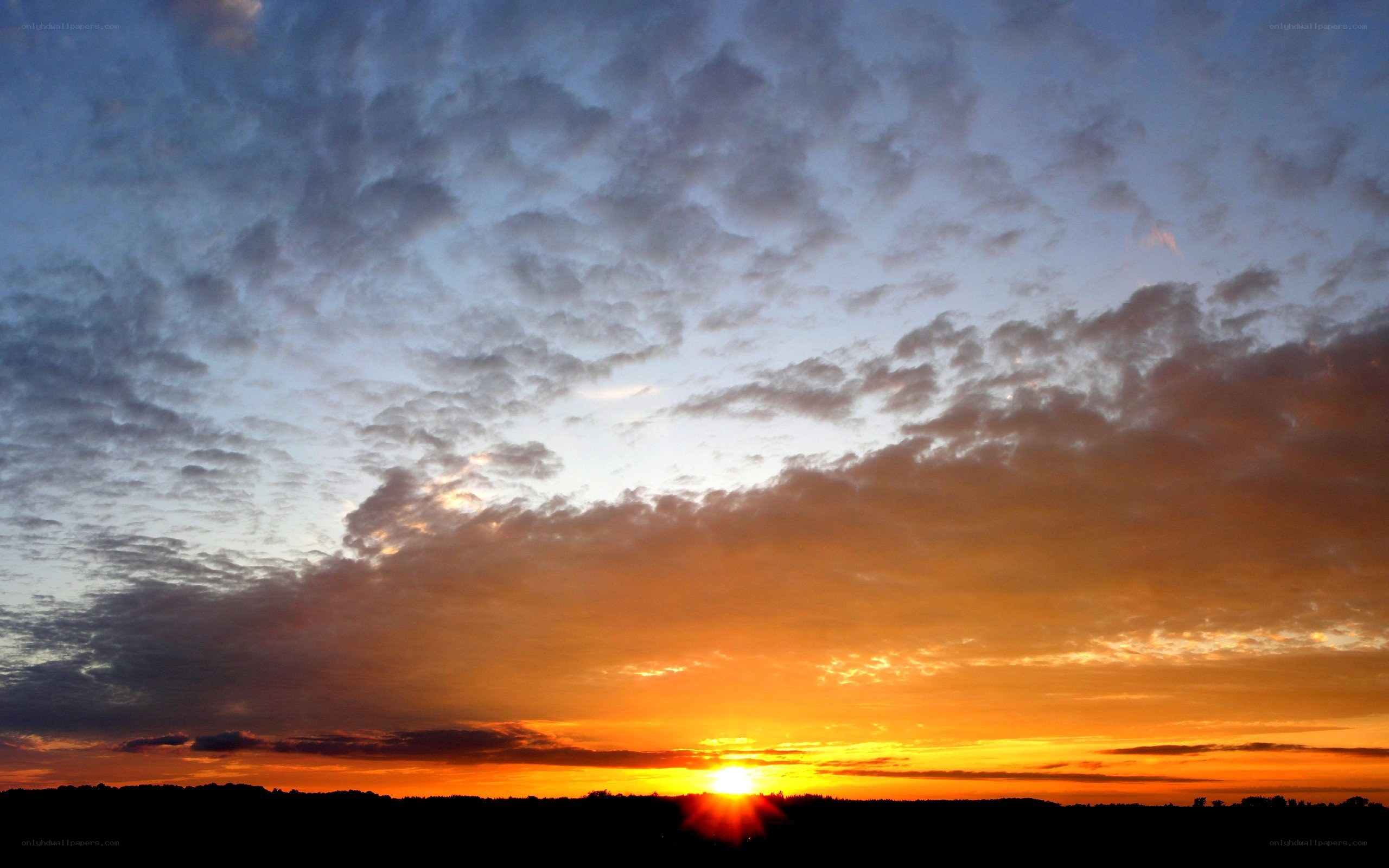 Sunset over a cloudy sky
