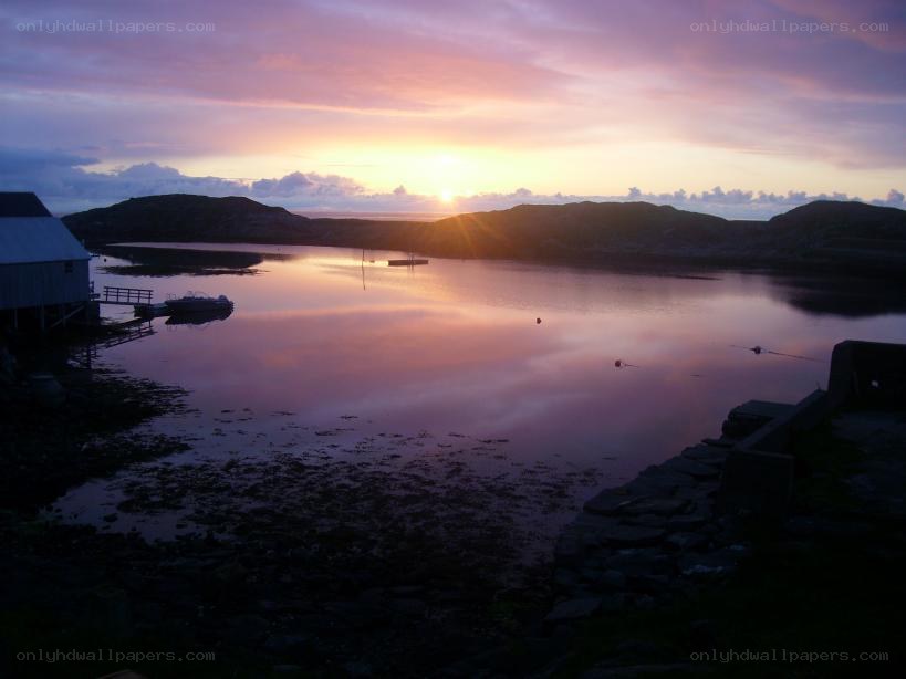 sunset over a coastal bay