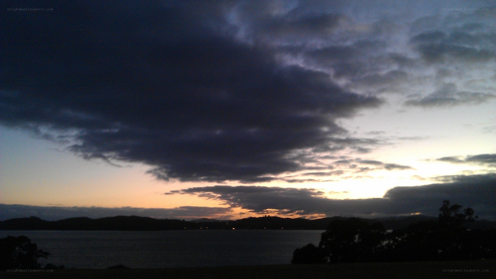 sunset over a coastal bay