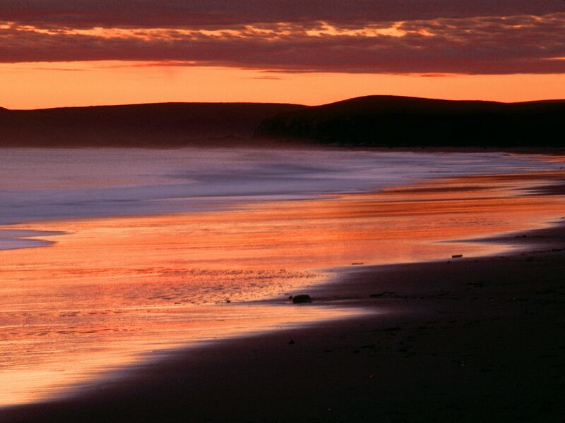 sunset over a coastal beach