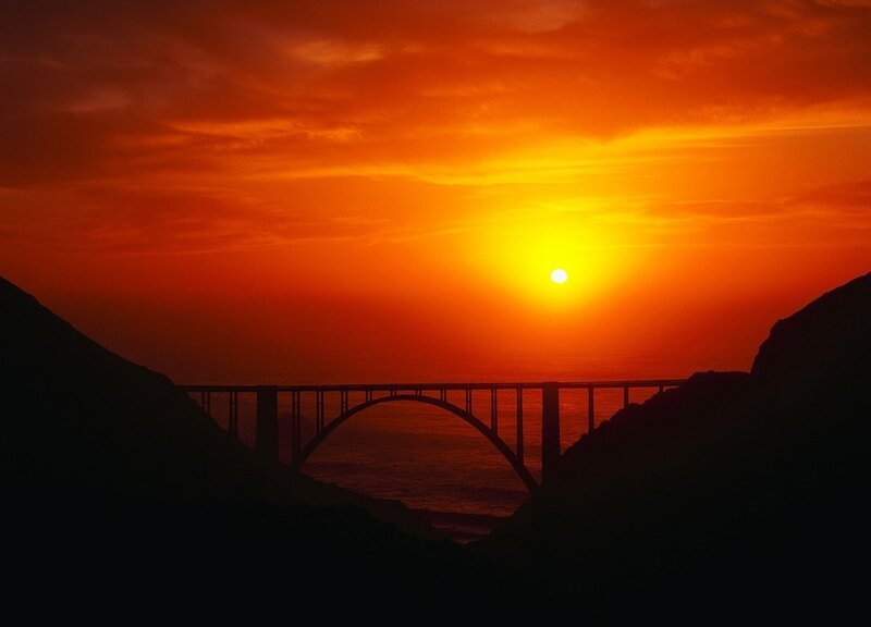 Sunset over a coastal bridge