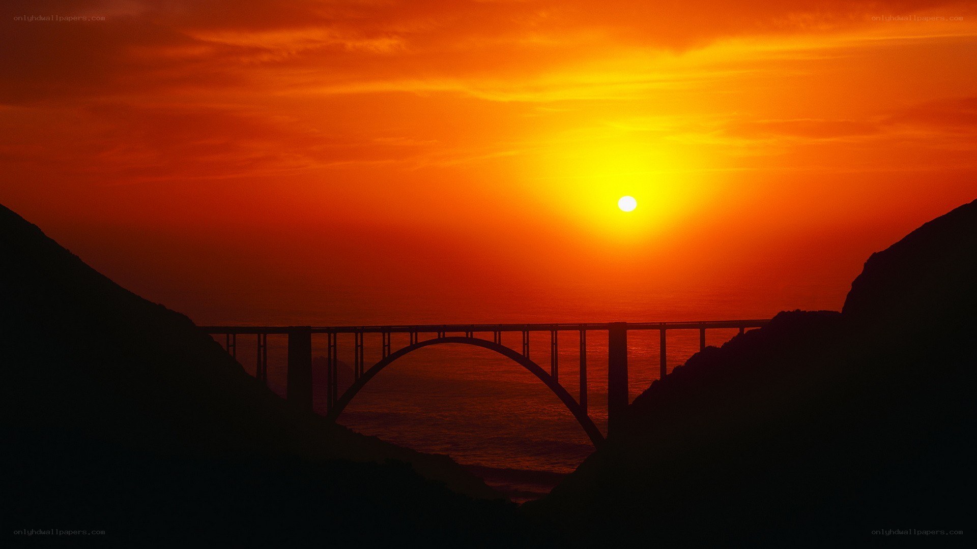 Sunset over a coastal bridge