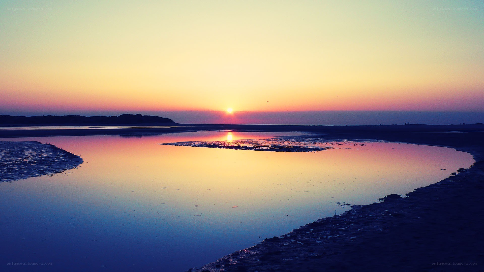 Sunset over a coastal inlet