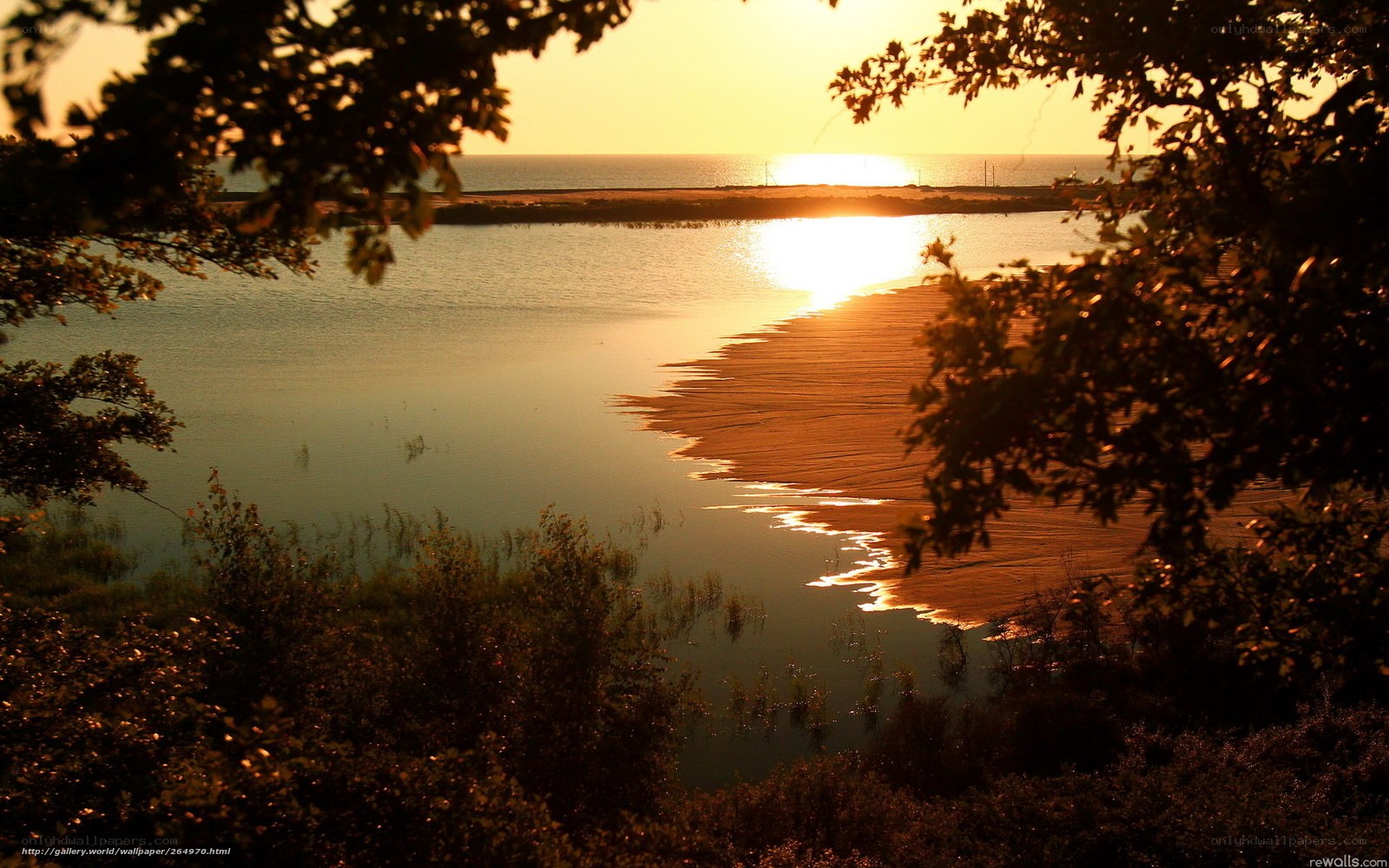 sunset over a coastal inlet