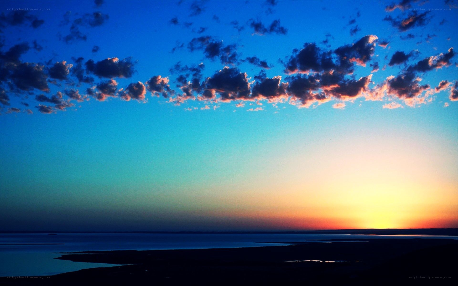 sunset over a coastal landscape