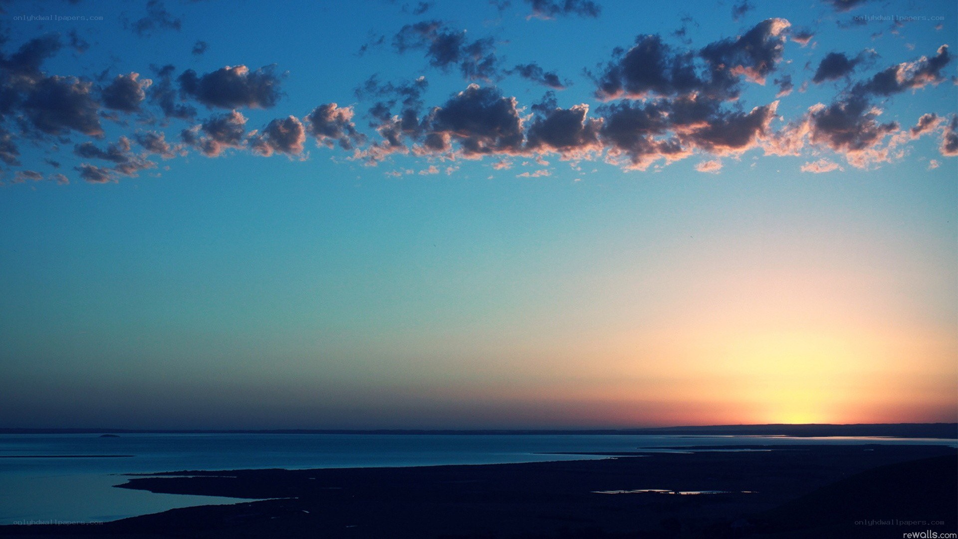 sunset over a coastal landscape
