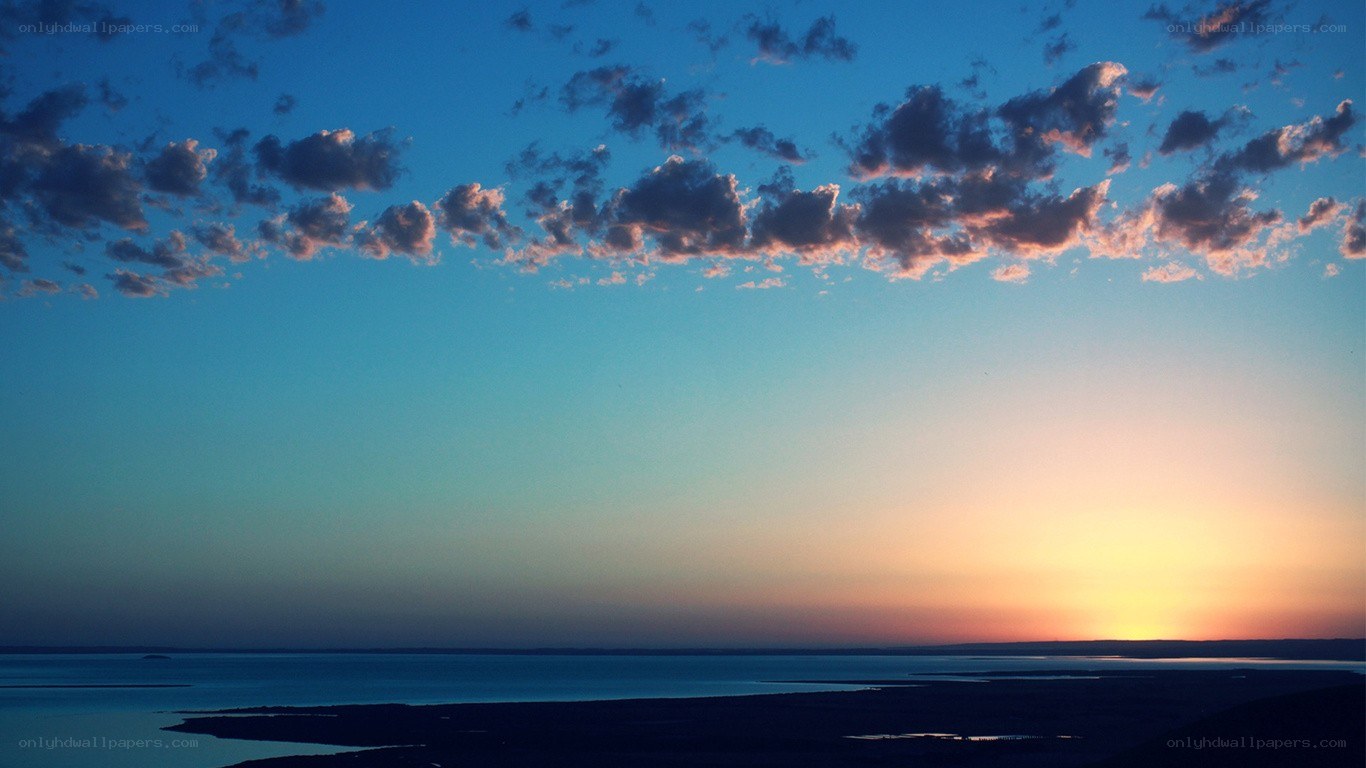 sunset over a coastal landscape