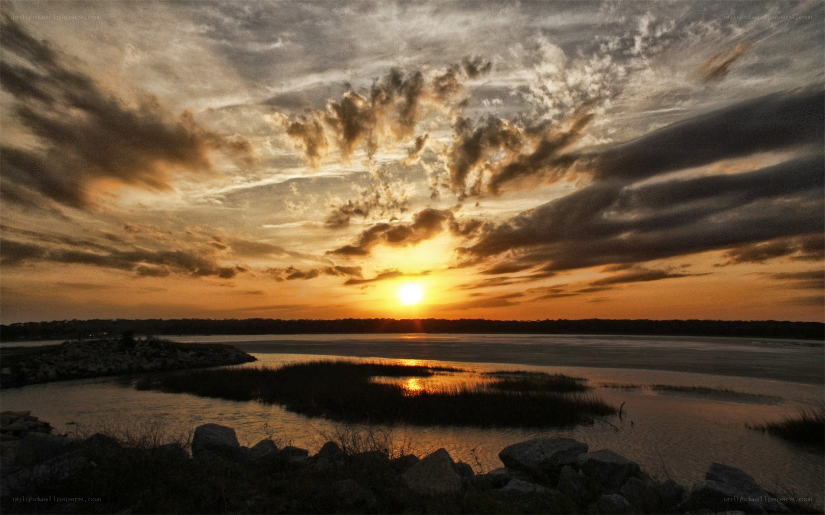 sunset over a coastal marsh