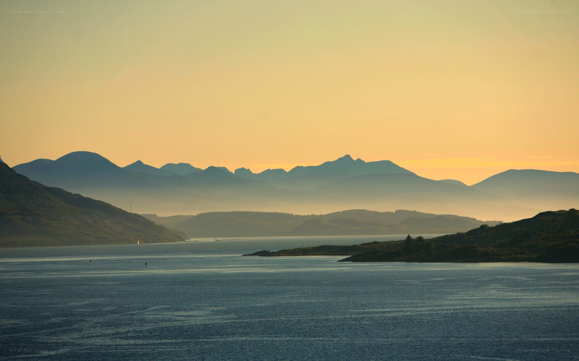 sunset over a coastal mountain range