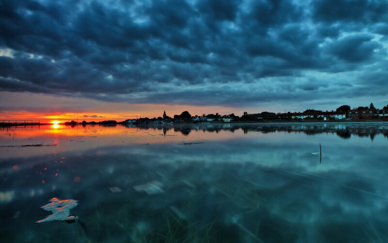 Sunset over a Coastal Town — Blue