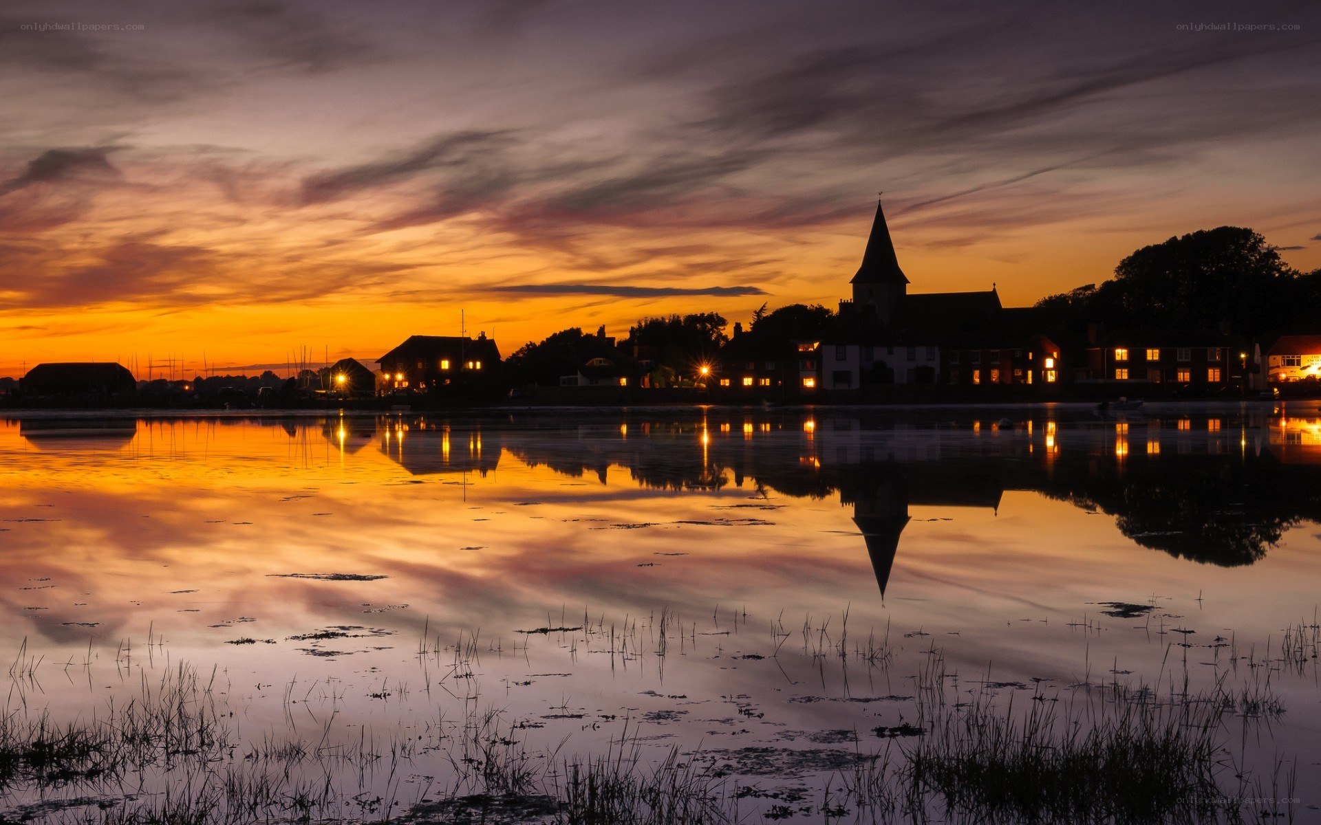 sunset over a coastal village