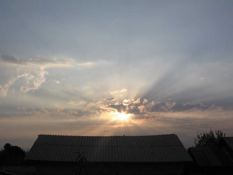 Sunset over a corrugated roof