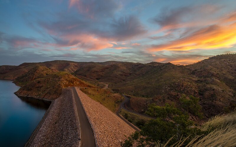 Sunset over a dam and hills
