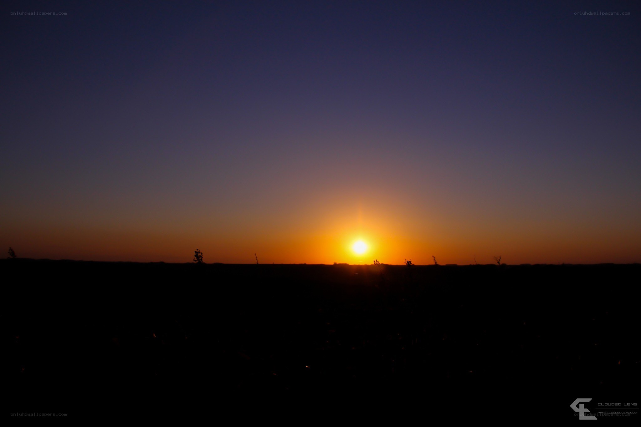 Sunset over a dark field