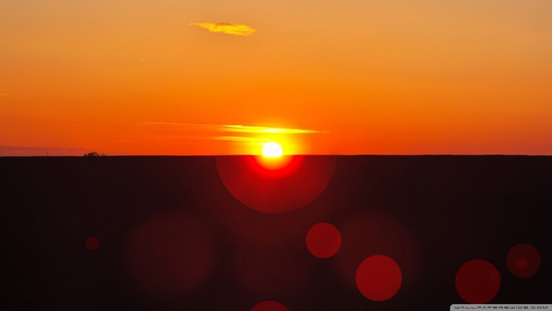 Sunset over a dark landscape