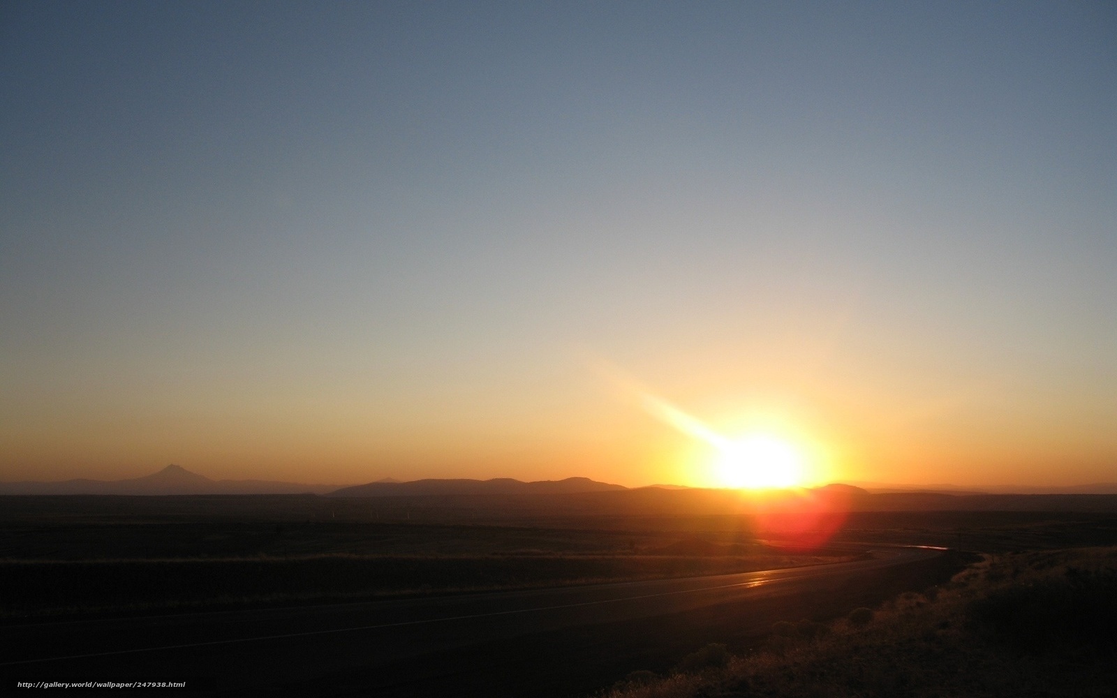 Sunset over a desert highway